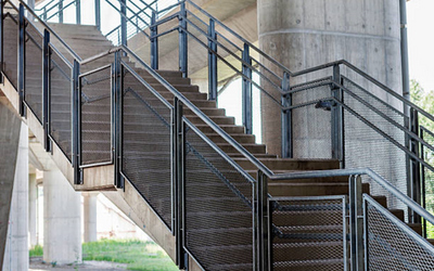 Wire mesh infill stair railing